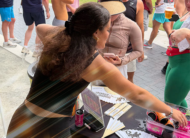 Brand Ambassador interacting with a people at an outdoor event