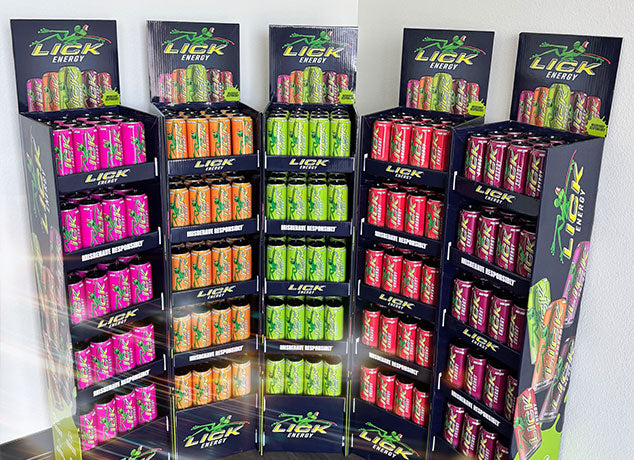 Display of Lick Energy packaging with various flavors in colorful boxes.
